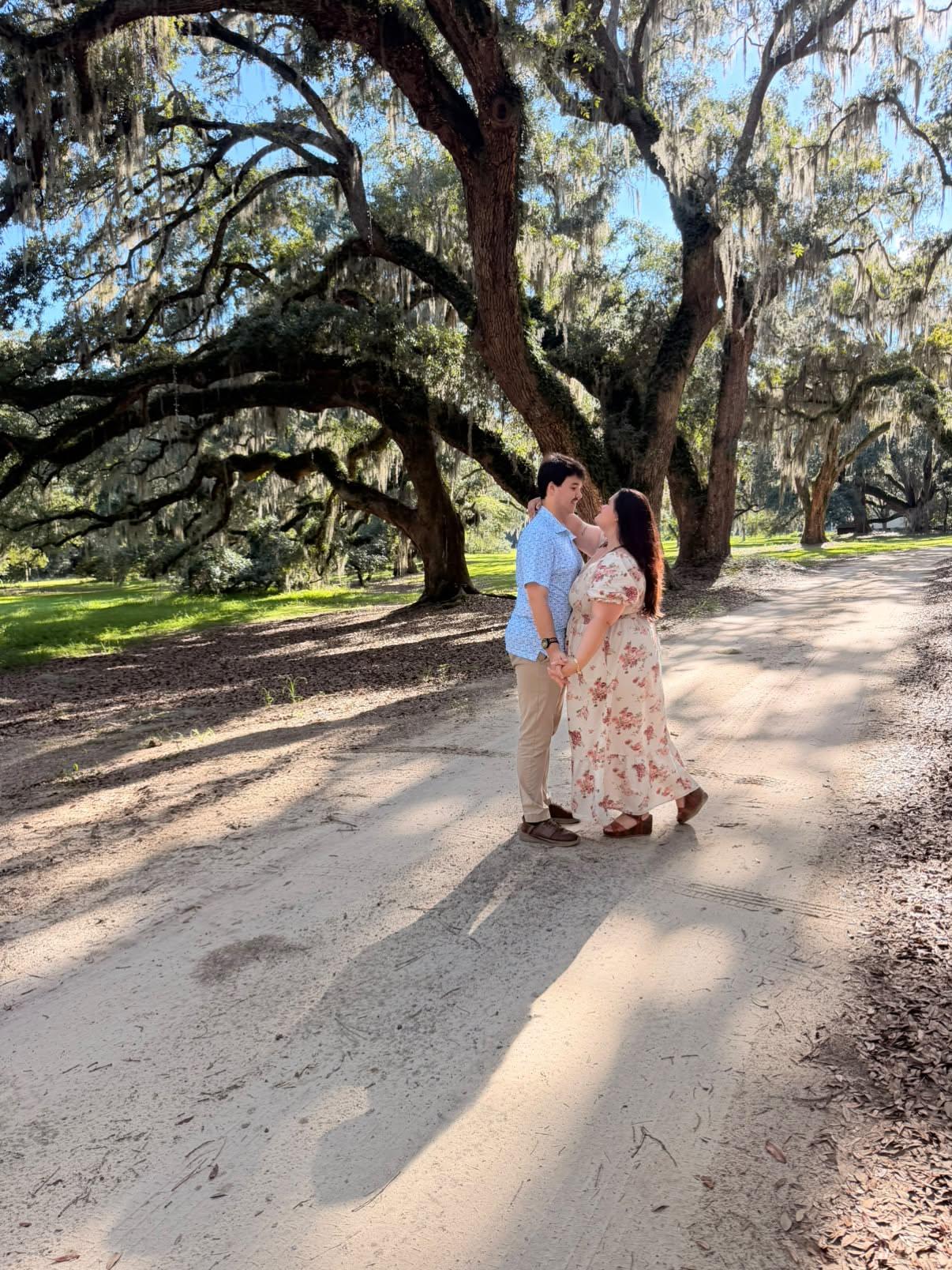 Sophia and Ian beneath the live oaks